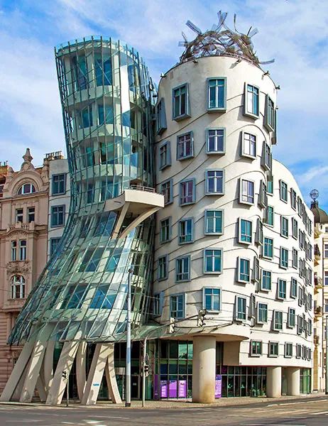 Frank Gehry Buildings and Architecture | Architectural Digest Deconstructivism Architecture, Calatrava Architecture, Architecture Futuristic, Frank Gehry Architecture, Gehry Architecture, Futurist Architecture, Building Green, Architecture Cool, Dancing House