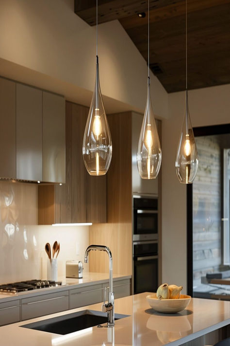 A gallery of 40+ stunning pendant lights over kitchen islands, highlighting various styles and materials. Three Pendants Over Island, Counter Bar Lighting Design, Hanging Light Pendant Kitchen Islands, Over The Kitchen Island Lighting, Pendant Light Size Over Island, Kitchen Island 3 Pendant Lights, Lamps Kitchen Island, Island Lamps Kitchen, Chandelier Island Kitchen