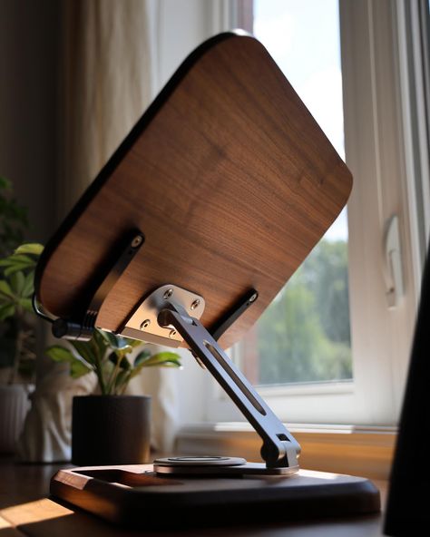 📖📚💻Upgrade your workspace with our 2-in-1 Adjustable Laptop Stand and Book Holder, crafted from luxurious black walnut wood. This premium, durable stand offers 360-degree adjustability for perfect viewing angles, blending functionality with elegance. Perfect for both laptops and books, it transforms your desk into a sophisticated, productive haven. 🎧 #WorkspaceGoals #LaptopStand #HomeOffice #BlackWalnut #DeskAccessories #ProductivityBoost #LuxuryDesign #TechGadgets #BookHolder #ErgonomicDesi... Laptop Stand Aesthetic, Tablet Holder Diy, Genius Inventions, Laptop Stand Wood, Laptop Stand For Desk, Adjustable Laptop Stand, Luxury Desk, Apple Watch Stand, Home Studio Setup