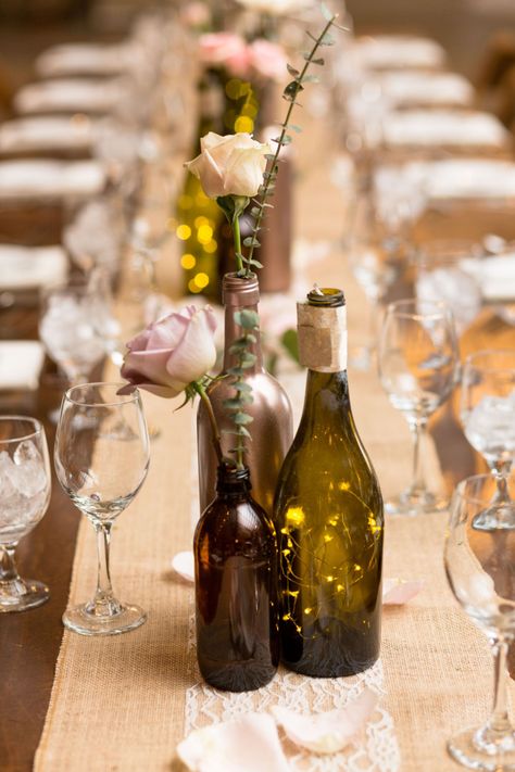 Wine bottle centerpieces on farm tables by Little Miss Lovely // Ocean City, MD wedding florist // Covered Bridge Inn Wedding Wine Bottle Wedding Decor, Wine Bottle Wedding Centerpieces, Wine Bottle Table, Wine Bottle Vases, Wine Bottle Centerpieces, Wedding Wine Bottles, Bottle Centerpieces, Wine Dinner, Wedding Reception Centerpieces