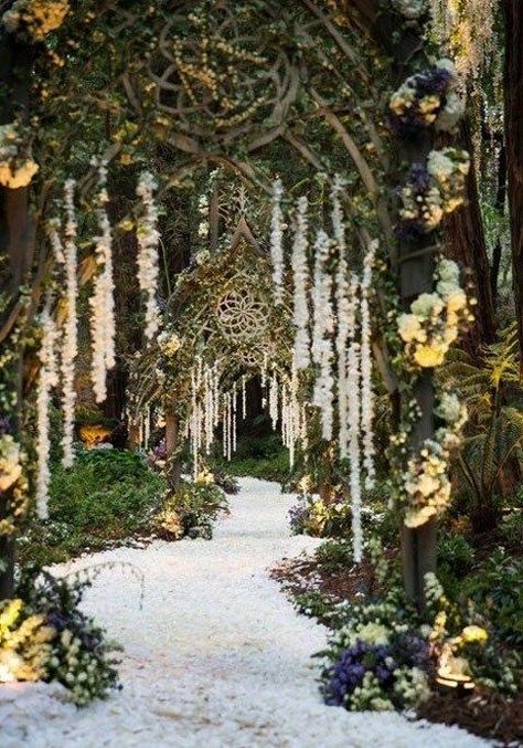 a unique pathway to the ceremony or reception space with arches with vines and floral garlands hanging down Enchanted Forest Decorations, Cottage Core Wedding, Twilight Wedding, Cottagecore Wedding, Wedding Forest, Forest Theme Wedding, Enchanted Forest Wedding, Extravagant Wedding, Enchanted Wedding