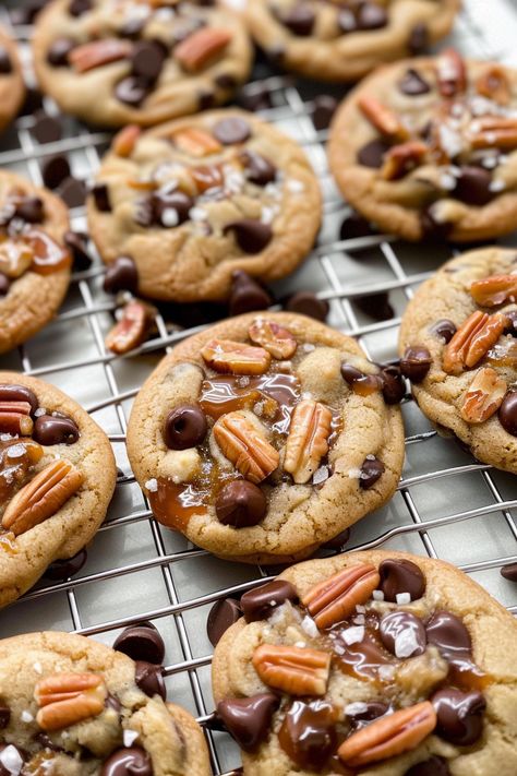 These Salted Caramel Pecan Chocolate Chip Cookies are the perfect combo of sweet, salty, crunchy, and chewy. Loaded with chocolate chips, pecans, and caramel sauce, and finished with a sprinkle of sea salt, these cookies will satisfy all your cravings. They’re easy to make and great for sharing (or keeping all to yourself!). Get the full recipe and start baking these delicious cookies today! Pecan Chocolate Chip Cookies, Pecan Chocolate, Chocolate Chip Pecan Cookies, Salted Caramel Cookies, Carrot Cake Cheesecake, Chocolate Chip Cookies Recipe, Pecan Cookies, Caramel Cookies, Delicious Cookies