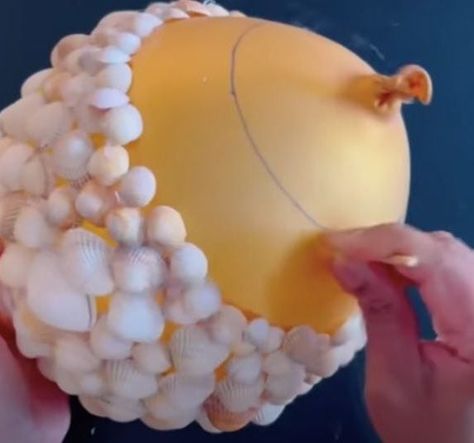 Woman uses hot glue and balloons to make the most adorable seashell flower pots Seashell Planter Ideas, Seashell Pots Planters, Sea Shell Planters, How To Make Shell Flowers, Diy Shell Projects, Seashell Flowers How To Make, Shell Gifts Diy, She’ll Christmas Ornaments, Sea Shell Projects