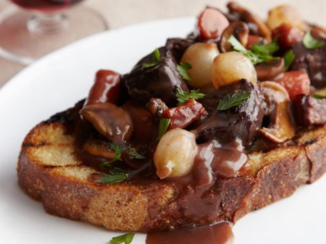 Ina Garten's Beef Bourguignon - In this foolproof take on the classic, often complex French stew, beef is simmered in red wine in the oven — not on the stove — at a constant temperature for perfect results every time. http://www.foodnetwork.com/recipes/ina-garten/beef-bourguignon-recipe.html Beef Bourguignon Recipe, Ina Garten Recipes, Munnar, Beef Dishes, Food Network, Main Dish, Soups And Stews, Food Styling, Taste Buds