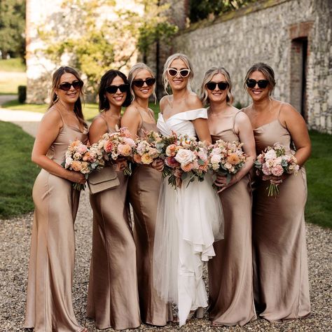 Butley Priory & Black Tie weddings - a match made in heaven! Here's Barrie and Grace leading the way with their groomsmen and bridesmaids, dressed in a delectable black tie and cappuccino gold dresses. A very elegant colour palette, perfect for the September sunshine and the florals were simply divine... Photos: @da.studio.team Venue: @butleypriory Catering: @pharrisonchef Marquee: @eventsundercanvastipis Dress: @silkandmaplebridal Music: @gainsboroughquartet Flowers: @passionflowersb... Champagne Bridesmaid Dresses Black Suits, Dark Gold Bridesmaid Dresses, Different Shades Of Gold Bridesmaids, Bridesmaid Dresses September Wedding, Bridesmaid Dresses Champagne Gold, September Wedding Bridesmaids Dresses, Champagne Bridesmaid Dresses Flowers, Bridesmaid Colour Palette, Black Groomsmen Champagne Bridesmaids