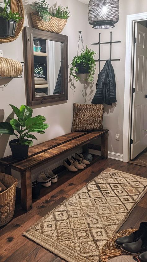 Cozy and organized entryway with wooden bench, woven basket, hanging plants, framed mirror, and geometric rug. Functional and stylish home decor ideas. Shoe Storage Mirror, Organized Entryway, Storage For Shoes, Victorian Room, Shoe Bench Entryway, Entryway Design, Textured Rug, Rustic Entryway, Smart Organization