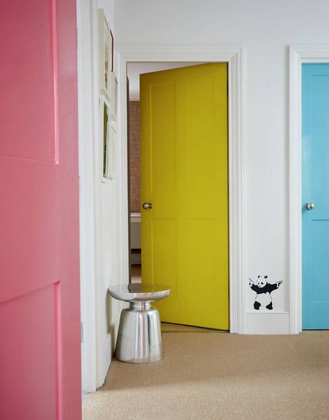 In this project, the interior designer [link url="https://www.houseandgarden.co.uk/article/henri-fitzwilliam-lay-house"]Henri Fitzwilliam-Lay[/link] had the doors of three children’s rooms painted in different pastel colours to make the landing feel ‘playful and whimsical’. This would work equally well in a more grown-up space, using darker or more muted tones. It is a clever way to perk up a small area in which the opportunities for decorating are more limited. Painted Hallway Doors, Colored Doors Interior, Paint Doors Interior, Painted Bedroom Doors, Colourful Rooms, Interior Door Color, Colored Doors, Interior Door Colors, Hallway Door