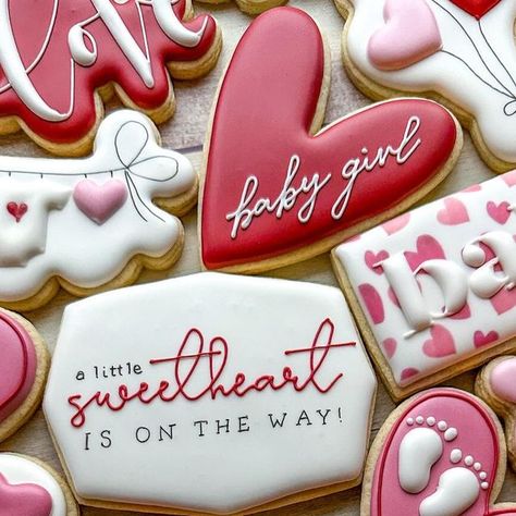 Emily’s Bake Shop on Instagram: "A little sweetheart is on the way! ❤️ the absolute cutest Valentine’s Day baby shower theme! I love the clothesline cookie and the “baby” plaque 🥰 • • #emilysbakeshop #customcookies #decoratedcookies #cookier #cookieart #njbaker #njcookies #sugarcookies #sugarcookiedecorating #sugarcookiemarketing #valentinesdaycookies #babyshowercookies #sweetheartcookies #valentinesdaybabyshower" February Baby Shower Themes, February Baby Showers, Sweet Baby Shower Ideas, Cat Baby Shower, Angel Baby Shower, Girl Shower Themes, February Baby, Valentines Baby Shower