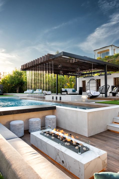 Tour This Bali-Inspired Backyard Resort - Foxterra Design Pools With Fire Features, Sunken Bar Pool, Sunken Backyard, Swim Up Bar Pool, Fire Pit Lounge, Sunken Seating Area, Resort Style Backyard, Villa Landscape, Rain Curtain