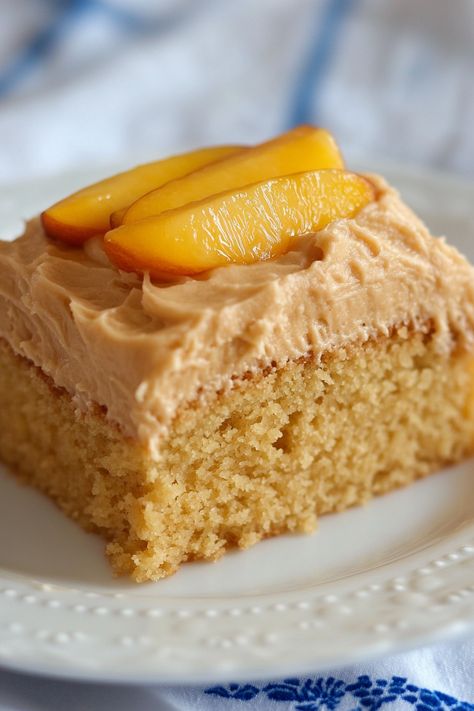 This Peach Cake with Brown Sugar Frosting can be enjoyed all year with fresh, frozen, or canned peaches. It's a breeze to prepare using a boxed cake mix, jello powder, and sliced peaches. Topped with a luscious brown sugar frosting that tastes like whipped caramel, each bite is a luxurious delight. Sometimes, you crave a Peach Cake With Brown Sugar Frosting, Cake With Cake Mix Boxes, Brown Sugar Peach Cake, Whipped Caramel, Desserts Peach, Recipe For Turkey, Brown Sugar Frosting, Sliced Peaches, Sugar Frosting