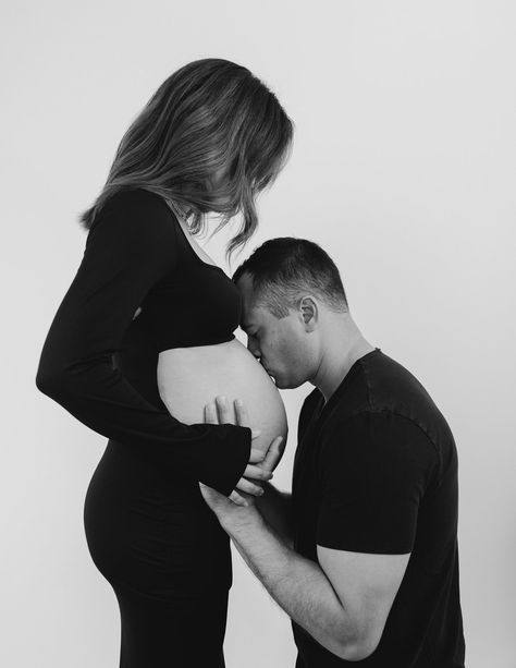 Maternity With Husband Photo Shoot, Maternity Photography Black And White Couple, Male Maternity Shoot Outfit, Black Shirt And Jeans Maternity Shoot, Black White Maternity Shoot, Black And White Maternity Shoot At Home, White Wall Maternity Shoot, Maternity Shoot With Partner, Maternity Pictures White Backdrop