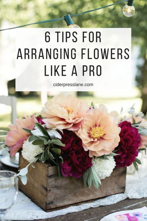 Six Tips For Arranging Flowers Like A Pro because we all need a little help looking professional! #floraldesign #flowerarranging #flowers #certerpieces #tablescapes #eventdesign #floral #springdesign #howto #howtoarrangeflowers #arrangingflowers #creatingcenterpieces #dinnerparty #tabledesign #gather #community #hosting #hostingtips #hostingaparty #partydecor #decor #floraldecor #easyflowerarranging Flower Arrangements Inspiration, Containers For Flower Arrangements, Easy Fall Floral Arrangements, Bouquet Without Flowers, Modern Flower Arrangements Centerpieces, Berry Flowers, Floral Mechanics, Floral Workshop, Fake Flower Arrangements