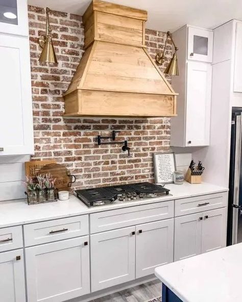 28 Wood Range Hood Ideas for an Engaging Kitchen Wood Range Hood Ideas, Range Hood White, Range Hood Ideas, Cabin Remodel, Brass Wall Sconces, Hood Ideas, White Countertop, Wood Range Hood, White Cabinetry