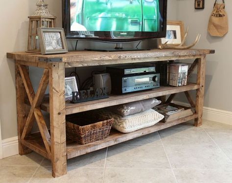 This TV Console can be used for your entertainment center, sofa table, and décor storage! SPACE* 6ft long x 30 tall x 22 deep (We can customize sizes)  COLOR* We offer a variety of stains. Weve used Special Walnut in the photo shown and always add a coat of Tung Oil Finish to give it a shine. We offer Early American, Driftwood, and Cherry stains and can match stains to your color swatch or décor pallet. We use bronze corner hardware and decorative bolts to give it a rustic feel and take custo... Rustic Tv Console, Wood Tv Console, Diy Tv Stand, Door Entrance, Router Woodworking, Living Room Tv Stand, Shop Organization, Main Door, Woodworking Project