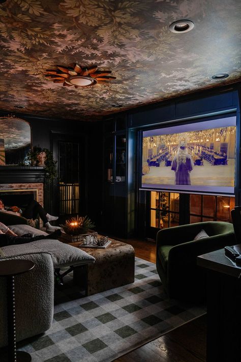 How to design the perfect small home theater setup with flexible media room seating, storage, lighting, and decor for a cozy space to spend family time. Moody Basement Theater, Home Theater And Library, Family Theater Room, Media Room Aesthetic, Blue Theatre Room, Cosy Media Room, Game Room/theater Room, Small Basement Media Room, Small Tv Den Room Ideas