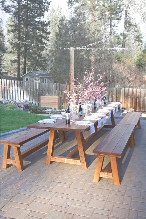 This Pinterest worthy outdoor table was constructed in two days, and took another three days total to sand, stain, and poly. It's the perfect outdoor wooden table. This pine table sits 16 comfortable on the sides, with another 2 possible at each end, for a total of 20 people! Considering all our outdoor gatherings, it's the perfect outdoor accessory. Outdoor Wooden Table, Outdoor Farmhouse Table, Outdoor Dinner Table, Outdoor Wood Table, Backyard Table, Wooden Garden Table, Table Picnic, Diy Outdoor Table, Outdoor Picnic Tables