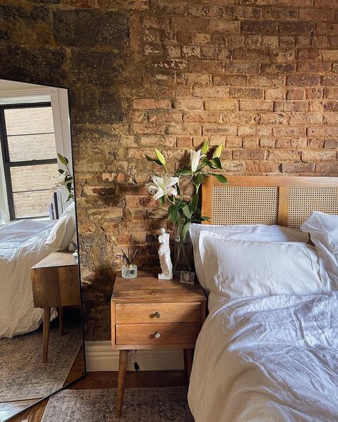 Small nyc apartment with exposed brick. White and clean decor. Brick Interior Apartment, Brick Boho Bedroom, Apartment Decorating Brick Wall, New York Exposed Brick Apartment, New York City Apartment Studio Brick Walls, Bedroom Ideas Exposed Brick, Exposed Brick Loft Bedroom, Brick Studio Apartment Ideas, Exposed Brick Apartment Decoration