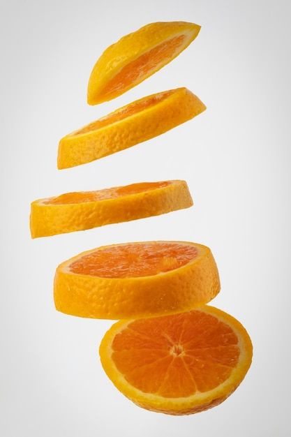 Free photo floating slices orange with c... | Free Photo #Freepik #freephoto #orange #orange-peel #fruit-slice #orange-fruit Orange Twist Garnish, Sliced Orange, Life Reference, Background Elements, Posts Ideas, Fruits Photos, School Painting, Orange Twist, Orange Slice