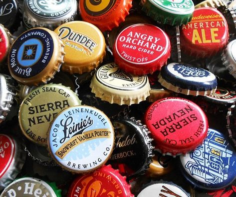 Give your beer cap collection a serious boost by purchasing this beer bottle cap variety pack. Each pack comes with an assortment of distinct brews from all over and of every shade, making them ideal to have on display in your man cave or bar. Beer Cap Coasters, Beer Cap Holder, Craft Beer Packaging, Beer Cap Art, Plastic Bottle Caps, Man Gifts, Beer Cap, Beer Bottle Caps, Beer Art