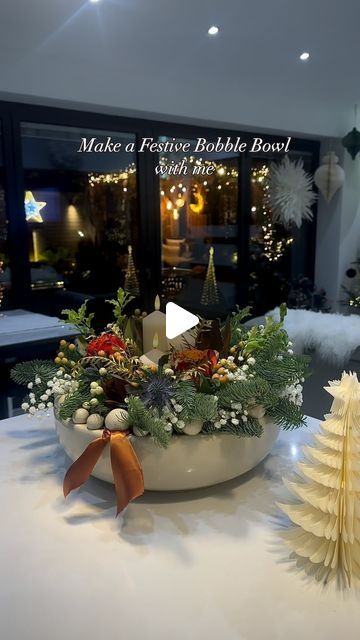 𝑱𝒂𝒏𝒊𝒄𝒆 Bristow on Instagram: "Make a Festive Bowl arrangement with me 🙌  I cut down a florist foam block a couple of inches to fit in the bowl but left a circle on it to raise the candles higher than the flowers.  Added water💧  I bought a stem of spruce from my local florist and cut off the sizes I wanted and pushed them in the sides of the foam .  I chose some stems and festive foliage from my local florists and cut the stems and pushed them into the top of the foam block keeping the circle clear.   When I was happy with the arrangement, I put a ceramic coaster on top of the circle and placed these cute candles on from @festivelightsltd   Added some left over ribbon 🎗️  I made this last Christmas and I cant wait to make one again when there are fresh festive stems in the florists Centrepieces For Christmas Table, Christmas Foliage Arrangements, Christmas Table Floral Arrangements, Christmas Candle Arrangements, Christmas Flower Arrangements Ideas, Christmas Floral Arrangements Diy, Spring Table Centerpieces, Christmas Arrangements Centerpieces, Centerpieces Christmas