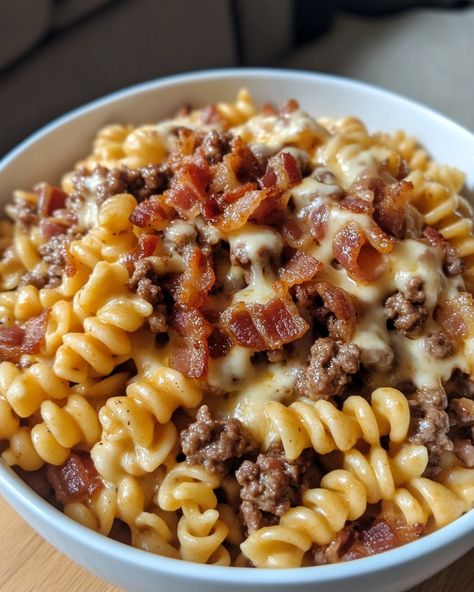 Loaded Bacon Cheeseburger Pasta 🍝🥓🧀 Ingredients: - 1 lb ground beef - 2 cups cooked pasta - 1 cup shredded cheddar cheese - 1/2 cup cooked bacon, crumbled - 1 cup milk - 1/4 cup flour - 1/4 cup ketchup - 1 tablespoon Worcestershire sauce - Salt and pepper to taste Instructions: 1. In a large skillet over medium heat, cook the ground beef until browned and fully cooked. Drain any excess fat. 2. Sprinkle the flour over the cooked beef and stir well to combine. 3. Gradually add the ... Cork Screw Pasta Recipes, Ground Beef Over Rice, Loaded Bacon Cheeseburger Alfredo Pasta, Loaded Bacon Cheeseburger Pasta, Pasta Recipes With Beef, Meat Based Meals, Bacon Dinner Ideas, Dinner With Pasta, Bacon Cheeseburger Pasta