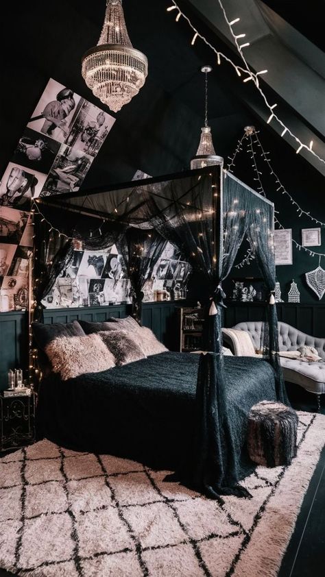 A captivating photo of a stylish boho-chic black bedroom. The room features a canopied bed adorned with a black lace canopy and fluffy pillows, surrounded by fairy lights. The walls are adorned with a mix of black and white photography, adding a vintage touch. A plush rug with a Moroccan-inspired pattern lies beneath the bed, creating a warm and inviting atmosphere. The room is enhanced by the presence of an ornate chandelier, more fairy lights, and a cozy reading nook with a chaise lounge., photo Black Fairy Lights Bedroom, Goth Boho Bedroom, Black Canopy Bedroom Ideas, Canopy Bed Aesthetic, Grey Boho Bedroom, Gothic Canopy Bed, Moody Boho Bedroom, Witch Bedroom, Ornate Chandelier