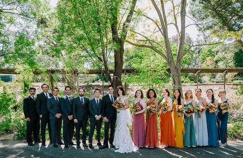 Rainbow wedding party Rainbow Wedding Bridesmaids, Multi Colored Bridal Party, Fall Rainbow Wedding, Multicoloured Bridesmaid Dresses, Rainbow Wedding Party, Rainbow Bridesmaids, Wedding Fest, Cottage Core Wedding, Yellow Bridesmaid