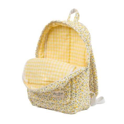 Our Buttercup Backpack is a charming and stylish bag designed to carry all your essentials with a timeless flair. The quilted exterior boasts a beautiful yellow floral pattern, complemented by the eye-catching yellow gingham interior. Designed for practicality, this backpack features a convenient exterior pocket for easy access to your essentials on the go. Inside, discover another dedicated pocket for added organization, ensuring that your belongings are always at your fingertips. Ideal for dai Quilt Backpack, School Bag Design, Gingham Interior, Yellow Backpack, Clothing Wishlist, Unique Backpacks, Yellow Gingham, Floral Backpack, Tool Bags