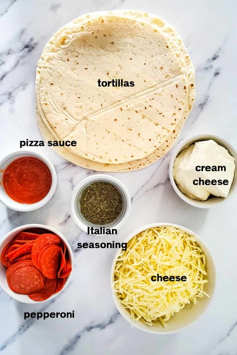 These Easy Pepperoni Pizza Tortilla Pinwheels are the perfect appetizer for a party or game day. Made with just a few simple ingredients and simple to make ahead. So delicious too! Pepperoni Rolls With Tortillas, Pepperoni Roll Ups Tortilla, Tortilla Pizza Roll Ups, Pepperoni Appetizers, Pinwheel Appetizers Easy, Pepperoni Pinwheels, Easy Pepperoni Pizza, Tortilla Hack, Pizza Tortilla