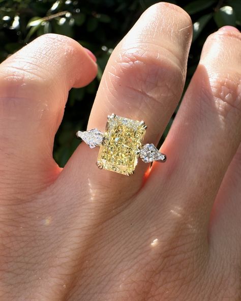 Swipe for more angles of this stunning yellow Radiant cut. 2.57ct yellow radiant cut diamond with kite side stones set in 14k yellow gold & platinum. #radiantcut #radiantcutdiamond #radiantcutdiamond #engagementring #diamondring #proposal #showmeyourrings #gettingmarried #howtheyasked #bridetobe #theknotrings #imengaged #theysaidyes #isaidyes #engaged #customjewelry #finejewelry Yellow Stone Engagement Rings, Radiant Yellow Diamond Ring, Yellow Canary Diamond Ring, Kite Side Stones, Canary Engagement Ring, Canary Diamond Engagement Ring, Canary Diamond Ring, Jewelry Goals, Radiant Cut Diamond Engagement Rings