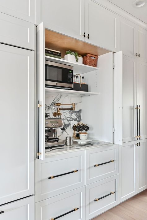 A wall of built-in cabinets is the perfect place to add a coffee/espresso station. The cabinet has pocket doors that slide into place so the cabinet can remain open during use. High end finishes include a porcelain countertop and backsplash and a luxe gold Brizo pot filler faucet. Hidden Coffee Bar, Woodland Cabinetry, Coffee Bars In Kitchen, Balance Design, Dream Kitchens, Kitchen Inspiration Design, Built In Cabinets, Pantry Design, Kitchen Redo