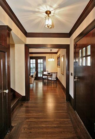 Tudor Style Bedrooms | The entryway at 822 Mendocino Ave. in Berkeley. The Tudor-style home ... White Walls Dark Brown Trim, Interior Door Colors, House Finishes, Dark Wood Trim, Bungalow Ideas, Stained Trim, Living Room Wood Floor, Dark Trim, Historic Restoration