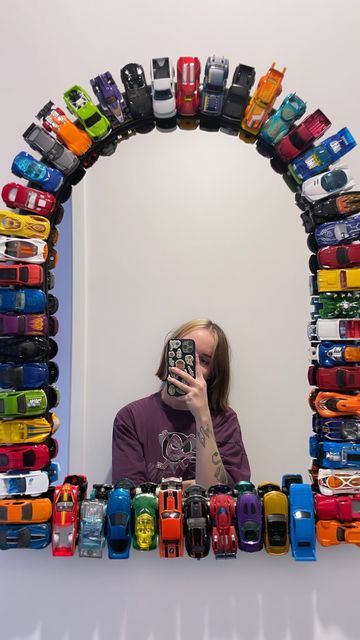 Jess 🫶🏻 on Instagram: "Just out here being crafty 🚗🚙🛻
The mirror and cars were all either from marketplace or thrifting x

#hotwheels #hotwheelscars #hotwheelsmirror #diyprojects #diyhomedecor #fastandfurious #diymirror #thrifted #mightyducks" Hot Wheels Bathroom Ideas, Hot Wheel Car Display Ideas Diy, Hot Wheels Mirror Diy, Hot Wheels Mirror, Hotwheels Mirror Diy, Hot Wheels Wall Decor, Hotwheel Car Collection Display, Car Mirror Decorations, White Sandals Heels