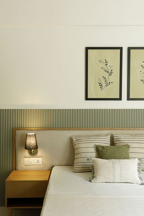 Parent’s Bedroom -This bedroom has a delicate fluted panel in moss green shade as a backdrop for bed and TV. The arched wardrobe and dressing panels in raw wooden textures allow it to blend seamlessly with the theme. The contrasting black linen lights on the headboard and long white curtains makes the room warm and cozy. Colour Palette Home Interior Design, Minimalistic Interior Bedroom, Bedroom Headboard Design Modern, Rooms Interior Bedroom, Bed Back Design Headboards, Colour Palette For Bedrooms, Parents Room Design, Headboard Design Modern Bedhead, Headboard Design Modern