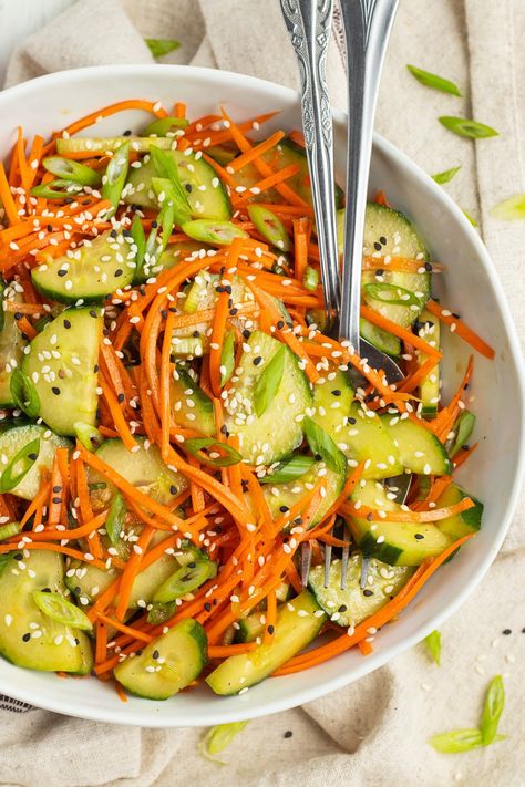 Crisp, and deliciously refreshing, this easy to prepare cucumber and carrot salad is tossed in a tasty soy and sesame dressing. Soy Cucumber Salad, Carrot And Tomato Salad, Asian Carrot Salad, Korean Carrot Salad, Cucumber Slaw, Cucumber Carrot Salad, Plant Meals, Carrot Salad Recipes, Vegan Chinese