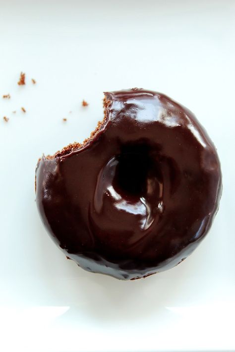 Donuts aren’t just for breakfast anymore.  Especially when you have a rich chocolate donut covered in a chocolate glaze.  These baked donuts are like miniature desserts that are super moist, packed with chocolate flavor and finished off with a shiny chocolate frosting.  Perfect with coffee, tea, milk, soda, beer, wine, margaritas … ok, maybe not margaritas.  Recipe on butterandbliss.net. Donut Party Ideas, Brownie Vegan, Donut Baking Pan, Easy Donut Recipe, Donut Toppings, Making Donuts, Chocolate Donut, Dessert For Two, Homemade Donuts