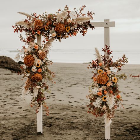 Beautiful and lush Autumnal arch #ceremonyarch #ceremonyinstallationwedding #bohowedding #beachwedding #autumncolorpalette Wedding Arch Fall Flowers, Wedding Arch Flowers Boho, Fall Flower Arch, Wedding Arch Ideas Fall, Autumn Wedding Shawl, Arches Wedding, Autumn Arch Wedding, Autumn Beach Wedding, Fall Arches For Weddings