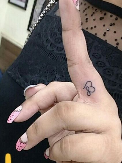 Top 24 Fingers Heart Tattoos To Must Try In 2024 Healed Finger Tattoos, Infinity Finger Tattoos, Infinity Heart Tattoo, Finger Tattoos Fade, Infinity Love Tattoo, Love Finger Tattoo, Tattoo Sister, Heart With Infinity Tattoo, Heart Tattoo On Finger