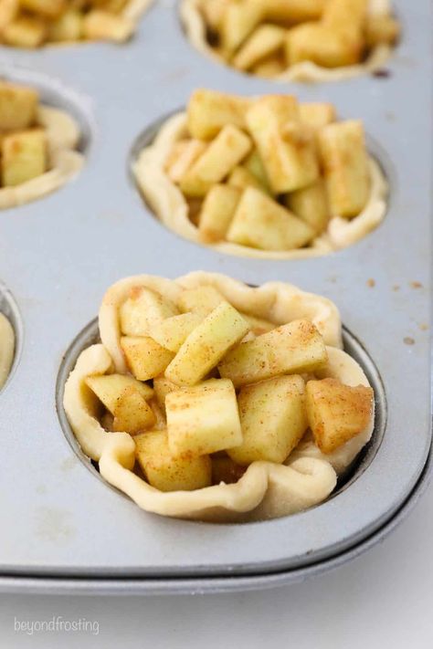 For such a cute bite-sized pie, these Mini Apple Pies are jam-packed with flavor! They’re easy to make and baked in a muffin tin. I topped with a simple yet mouthwatering crumble topping. Cupcake Pan Apple Pie, Apple Pie Mini Cups, Apple Pie Tarts Easy, Apple Pies In Cupcake Pan, Apple Pie In Muffin Cups, Apple Pie In Cupcake Tins, Mini Muffin Tin Apple Pies, Mini Pillsbury Pie Crust Recipes, Cupcake Apple Pies