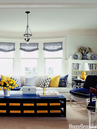 National Geographic magazines add a yellow punch. Design: Tom Stringer. housebeautiful.com. #blue #yellow Blue And Yellow Room, Happy Living Rooms, Blue And Yellow Living Room, House Beautiful Magazine, Yellow Room, Yellow Living Room, Blue Living Room, Yellow Accents, House Beautiful