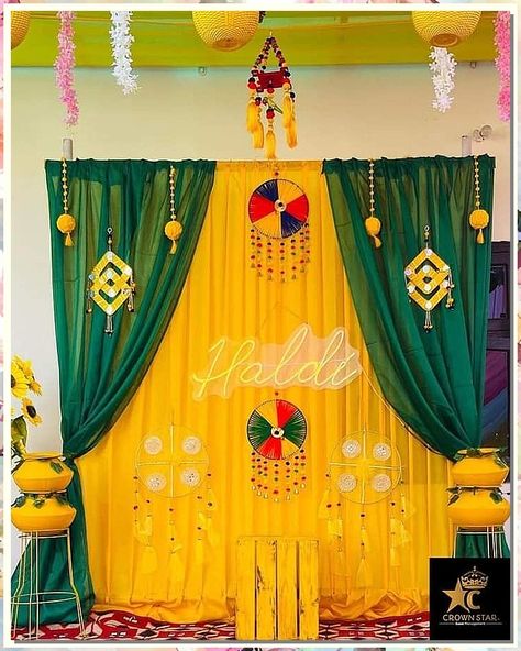 If you're looking for creative and affordable wedding decorations, check out our collection! We've got all the supplies you need to create beautiful decorations on a budget. Backdrop For Haldi Function, Haldi Wallpaper Background, Mehandi Theme Decor, Simple Haldi Backdrop At Home, Haldi Background Decoration At Home, Mehandi Function Decoration At Home, Haldi Function Decoration At Home Simple, Haldi Decoration Ideas Simple, Haldi Backdrop At Home