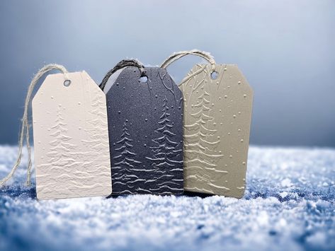 Simple embossed tags, elegantly portraying a snowy forest, are perfect for gift tags, winter scrapbooking, Christmas tags and more. The embossing is deep and clear on heavy pearlized/shimmer cardstock. An extra to/from tag is attached to the back for writing.  This peaceful scene can make your Christmas or Winter gift extra special! Embossed Tags, Custom Christmas Gift Tags, Christmas Tags Handmade, Holiday Gift Tags Printable, Christmas Tree Gift Tags, Winter Scrapbooking, Christmas Gift Tags Handmade, Gift Labels Christmas, Gift Tag Design