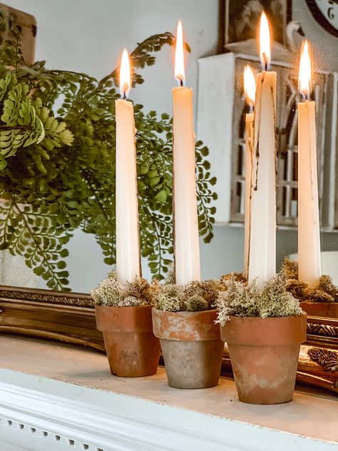 DIY Mossy Terracotta Pot Candles – Nickels Creek Mercantile Clay Pot Centerpieces Table Decorations, Diy Mini Taper Candles, Terracotta Pot Candles, Terra Cotta Centerpieces, Taper Candle Display, Candles In Terracotta Pots, Mini Terracotta Pots Crafts, Taper Candle Holders Diy, Taper Candle Decor