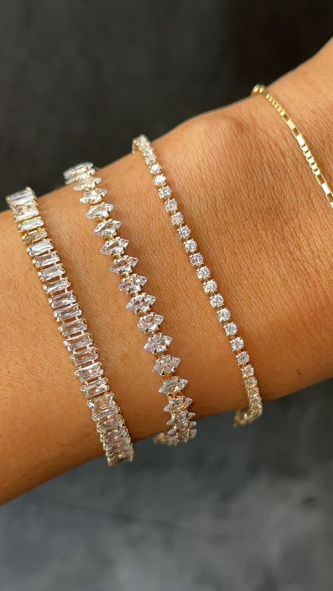 This timeless tennis bracelet was designed to fit seamlessly into your everyday stack- the petite stones shine in the light while the design remains subtle enough for everyday wear. Crafted with high-quality pavé stones that glimmer like real diamonds, this piece looks just like its expensive diamond counterpart. 14k Gold Plated with pavé stones Length: 6.25" + 2" Ext Please remove this piece prior to any water or sweat exposure, as the integrity and shine of the stones may be compromised by wat Jewelry Tennis Bracelet, Dainty Luxury Tennis Bracelet For Everyday, Pandora Tennis Bracelet Stack, Good Tennis Bracelet, Expensive Looking Jewelry, Elegant Bracelet Stack, Tennis Bracelet Marquise, Timeless Tennis Bracelet, Elegant Gold Tennis Bracelet