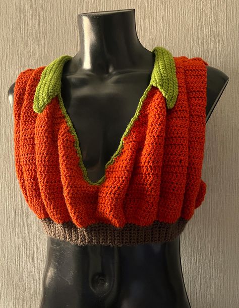 .pdf PATTERN ONLY  English Only   US Crochet Terms Size: 76-148cm/30"-58" Crochet PDF Pattern, Pumpkin Crop Top Skill Level: intermediate This crochet pattern is for a Seasonal Squash inspired crop top. Whether you are heading out for Halloween or spicing up a Thanksgiving Pie, you will want everyone to see you in this Pumpkin Crop Top. The design features multiple 3-D ruffles and a dramatic V-Neck. The collar can be any width you want, so keep it neat or make it big like pumpkin leaves. There i Cobweb Crochet Top, Disenchantment Halloween Costumes, Crochet Pumpkin Cardigan, Crochet Pattern Pumpkin, Fall Crochet Projects Clothes, Crochet Pumpkin Hat Pattern, Pumpkin Outfit Halloween, Crochet Cat Halloween Costume, Ribcage Crochet