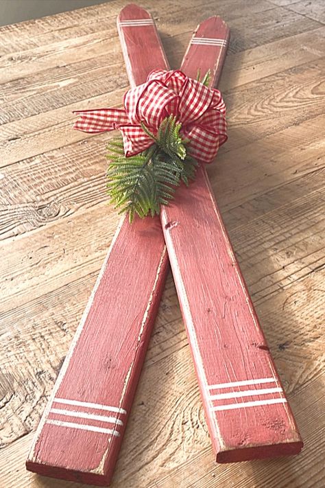 Make a pair of beautiful faux skis to decorate your home for the holidays or winter decor. Homeroad.net #skis #Christmas #Christmasdecor #winter #winterdecor #diyproject Picket Fence Decorating Ideas Diy, Decorating With Skis, Christmas Sleds Diy, Diy Snow Ski Decor, Ski Poles Decor Christmas, Skis For Christmas Decor, Diy Skis Christmas, Sled Decorating Ideas Diy, Things To Make Out Of Old Skis