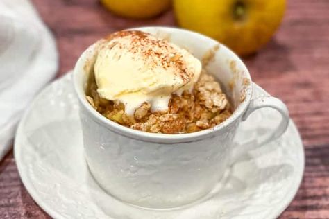 If you're looking for a quick and easy, warm dessert, this Microwave Apple Crisp in a Mug will be a new best friend. Warm chopped apples, bathed in a cinnamon butter and topped with a chewy oatmeal topping, is a 3-minute dream. And more delicious than I can tell you.  #applecrisp #microwave #microwavedesserts #apples #applecrisp #31Daily #quickandeasydesserts Apple Crisp In A Mug, Microwave Apple Crisp, Quick Apple Crisp, Microwave Apple, Slow Cooker Apple Crisp, Microwave Apples, Apple Brown Betty, Microwave Mug Recipes, Apple Crisp Topping