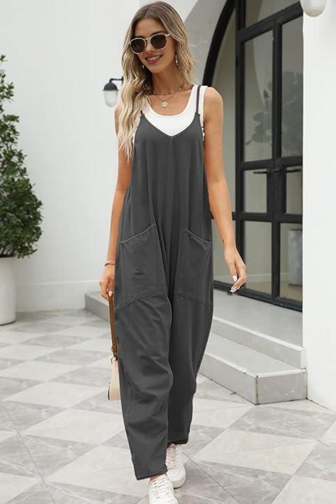 Step out in style with this effortless summer outfit Featuring a trendy grey jumpsuit paired with a white top, this look is perfect for casual outings or a day of shopping. Accessorized with stylish sunglasses and a chic handbag, this ensemble is both comfortable and fashionable. Embrace laid-back summer vibes without compromising on style! . SummerStyle #OutfitInspiration #CasualChic #JumpsuitFashion #TrendyLooks Tampa Florida Outfits, Jumpsuit Summer Outfit, Summer Jumpsuit Outfit, 10 Item Wardrobe, Chic Bodycon Dress, Summer Onesies, Baggy Overalls, Grey Romper, Jumpsuits Casual