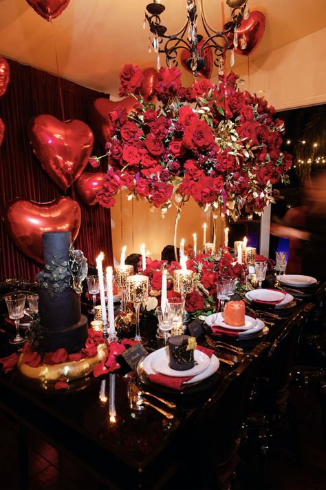 We're head over heels for this Valentine's Day dinner and moody tablescape Rich red roses, classic heart-shaped balloons, and glitzy black details made this a unique yet romantic setting. Find vendors for your own dinner parties in PartySlate's curated directory. Black And Red Valentines Decor, Rose Dinner Party, Condo Aesthetic, Moody Tablescape, Bday Stuff, Event Business, Birthday Party Decorations Diy, Valentine Party, Tablescape Ideas