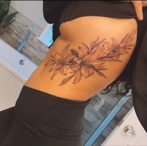 Tiger Side Tattoo For Women, Red Tattoo On Side Ribs, Back To Rib Tattoo, Tropical Rib Tattoo, Tiger Lily Tattoo On Back, Lily Flower Rib Tattoo, Rib Flower Tattoos For Women Side Tat, Side To Back Tattoos Women, Side Body Tattoos For Women Ribs Flower